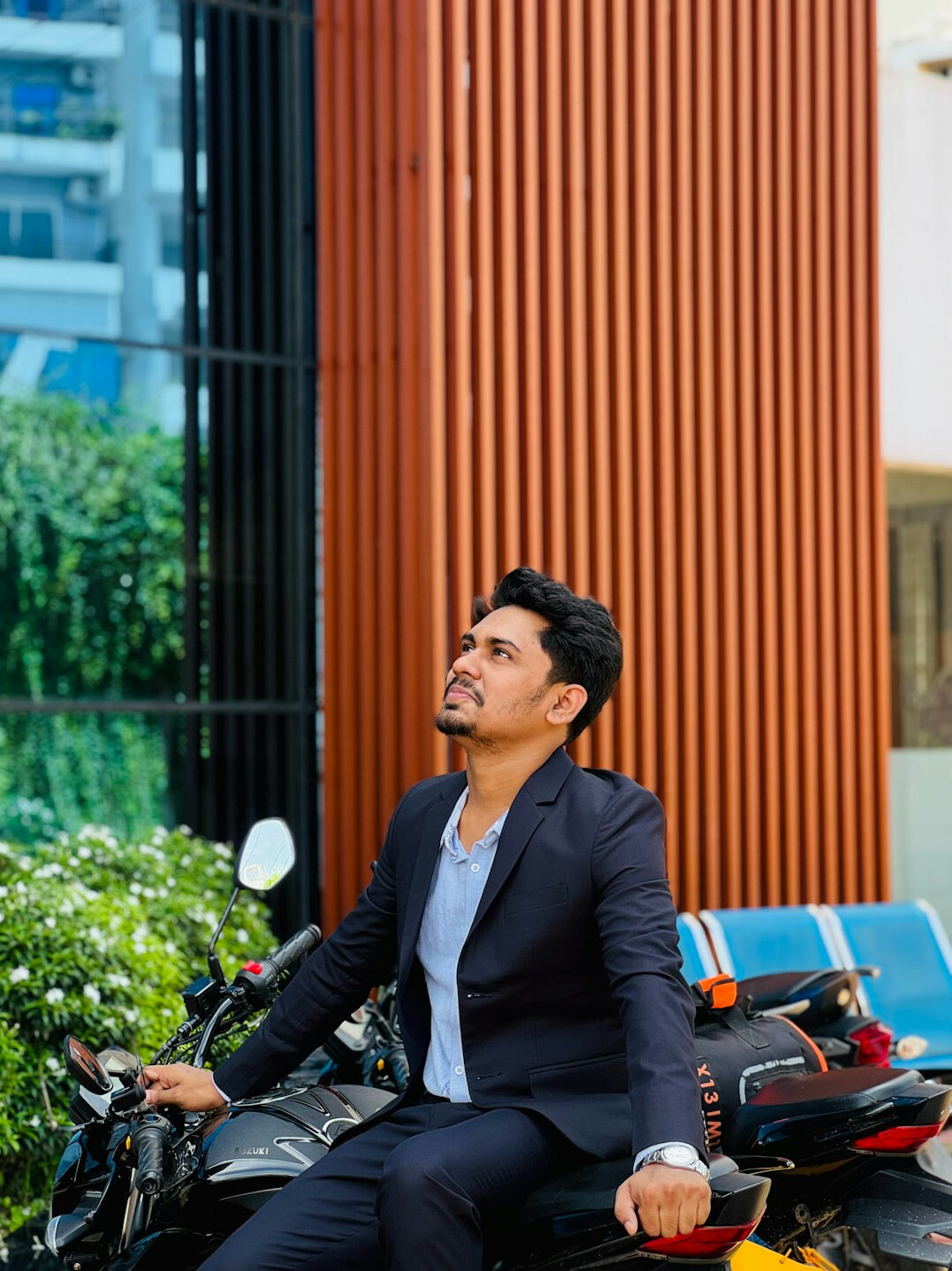 Studio portrait of an Indian Singaporean man in his 30s in business attire
